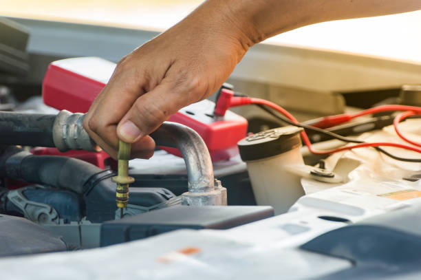 istock Auto mechanic uses hand of technician checking or fixing engine of in a car. 838478856