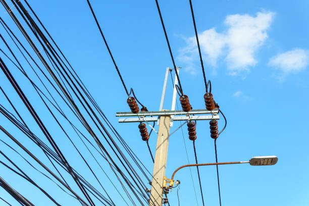 istock 230 Kv low voltage pole with electricity transmission line with blue sky and cloud 838479136
