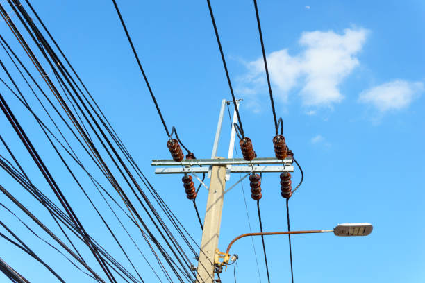 istock 230 Kv low voltage pole with electricity transmission line with blue sky and cloud 838479138