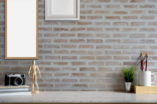 istock Mock up desk space modern home decor with camera, dummy, houseplant. Artist workspace with copy space for products display montage. 838481300