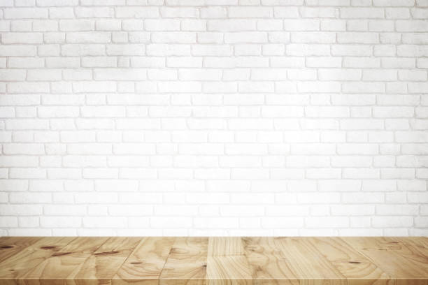 istock Wood table and white brick wall. for product display montage. 838481356