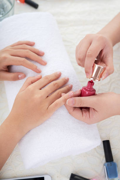 istock Painting nails with red color 838483746