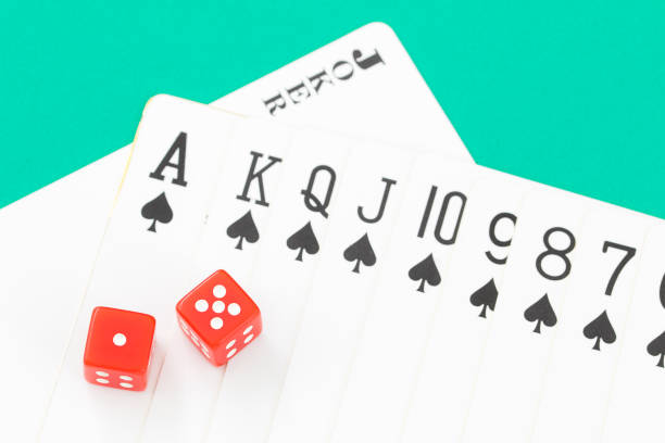 istock Dices and cards on green casino table 838490778