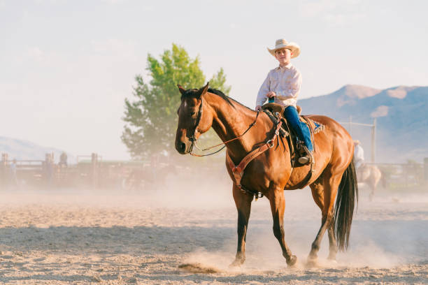 istock Young cowboy sitting on his horse 838491926