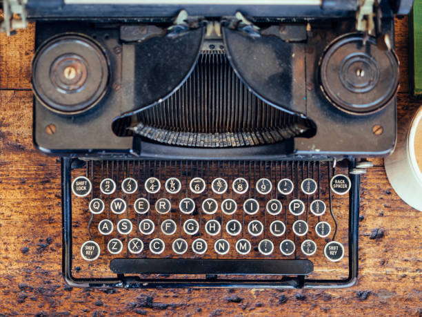 istock Vintage Typewriter on wooden table Top view 838492054