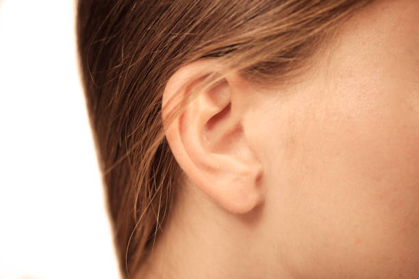 istock Close up on female ear 838492336