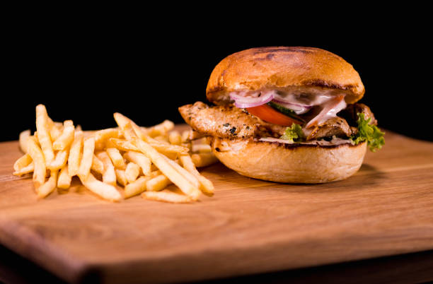 istock Typical American Fast Food - Chicken Burger with fries 838498066