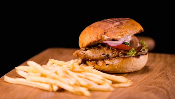 istock Typical American Fast Food - Chicken Burger with fries 838498194