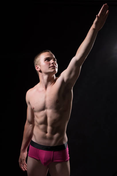 istock Young sportsman with a bare torso pointing towards 838499066