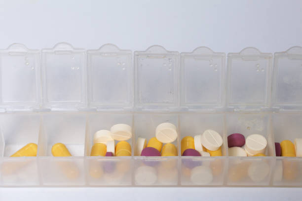 istock Tablets and pills are spread out into a container for tablets on the days of the week. Medicines of different shapes and colors. 838500050