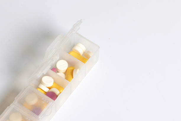 istock Tablets and pills are spread out into a container for tablets on the days of the week. Medicines of different shapes and colors. 838500056