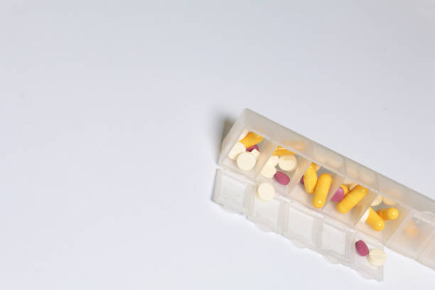 istock Tablets and pills are spread out into a container for tablets on the days of the week. Medicines of different shapes and colors. 838500062