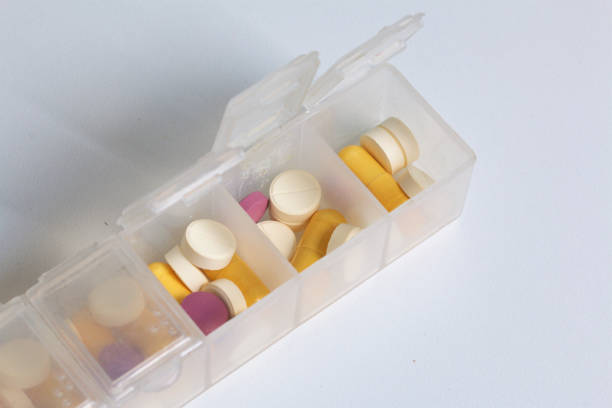 istock Tablets and pills are spread out into a container for tablets on the days of the week. Medicines of different shapes and colors. 838500086