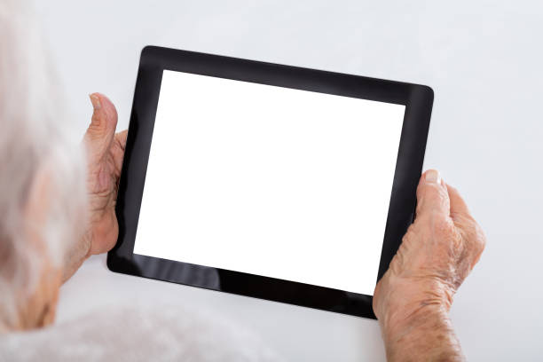 istock Senior Woman Holding Digital Tablet 838500756