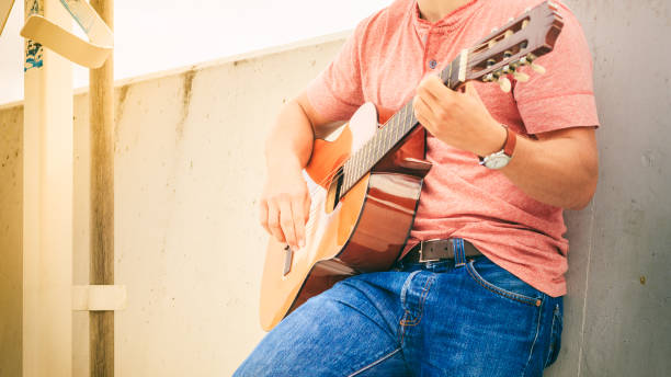 istock Trendy guy with guitar outdoor 838500762