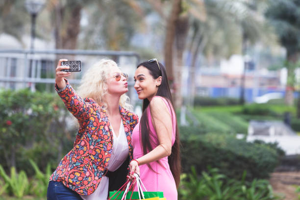 istock Friends coyly kissing one another for a selfie 838502022