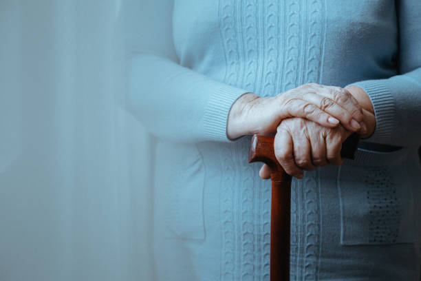 lady with walking stick - one old woman only imagens e fotografias de stock