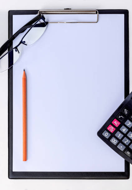 istock clipboard and calculator isolated on white background. 838502788