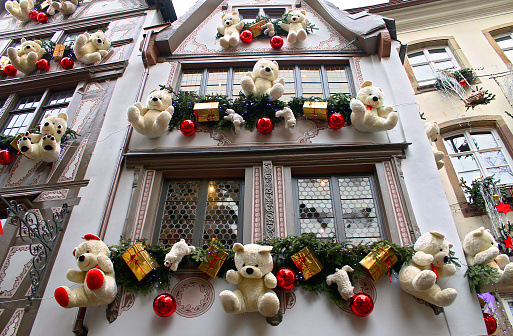 Teddy bear Christmas decoration in Strasbourg on a old house wall