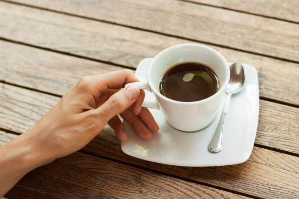 istock Hand with cup of coffee 838504268