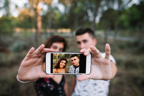 istock Young couple taking selfie 838505792