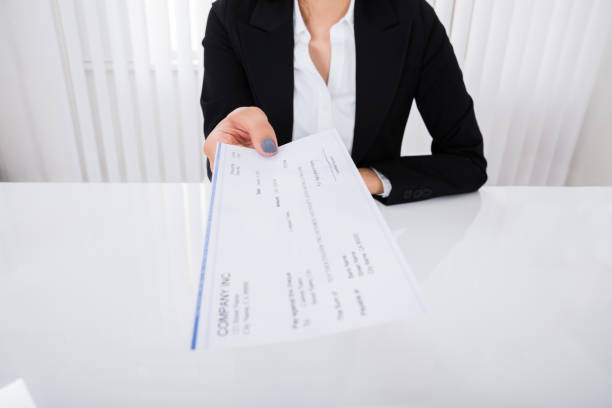 istock Businesswoman Offering Cheque 838506228