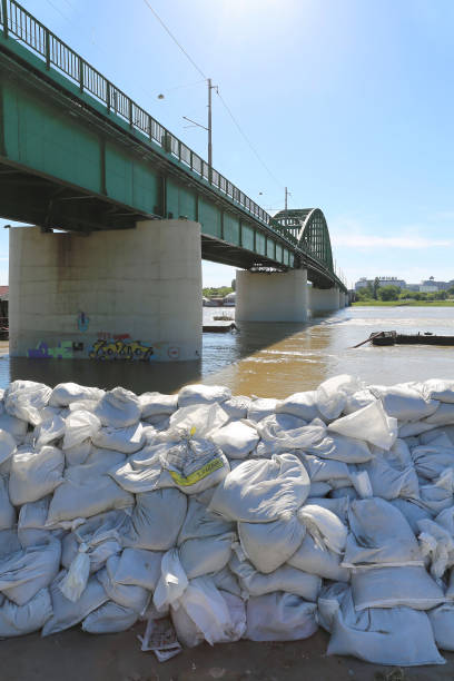 Old Sava Bridge BELGRADE, SERBIA - MAY 22: Sandbags in Belgrade on MAY 22, 2014. Old Bridge at Sava River and sandbags for flood protection in Belgrade, Serbia. flood preparation stock pictures, royalty-free photos & images