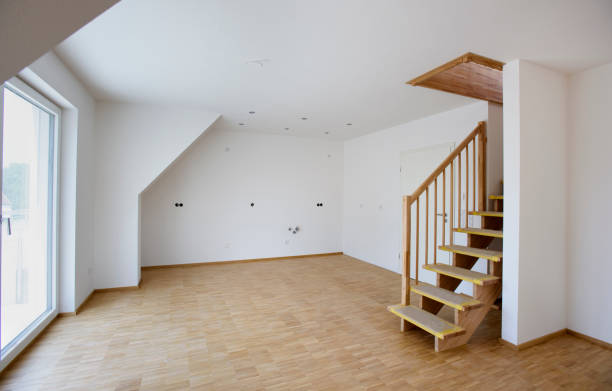 Bright room features large windows bare floors, ready for finishing touches personal decoration.