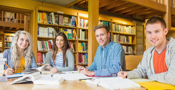 istock Group portrait of students at college desk 838511786