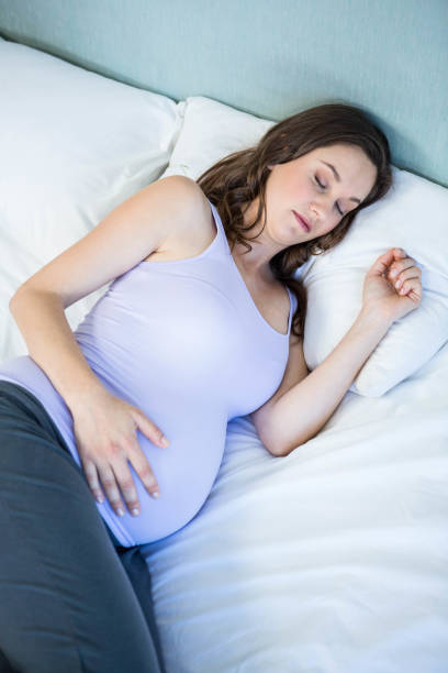 istock Pregnant woman sleeping in bedroom 838512104