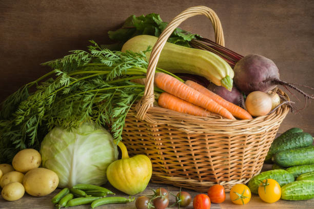 istock Different vegetables in the basket and on the table. Food background. 838515428