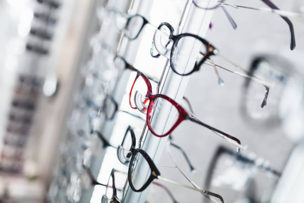 Eyeglasses store Close up shot of eyeglasses frames in optical store. optical instrument stock pictures, royalty-free photos & images