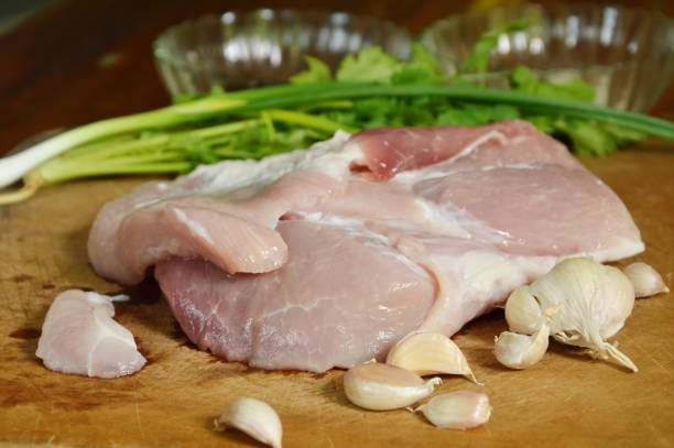 istock raw pork tenderloin with fermented ingredient on chop block 838519582
