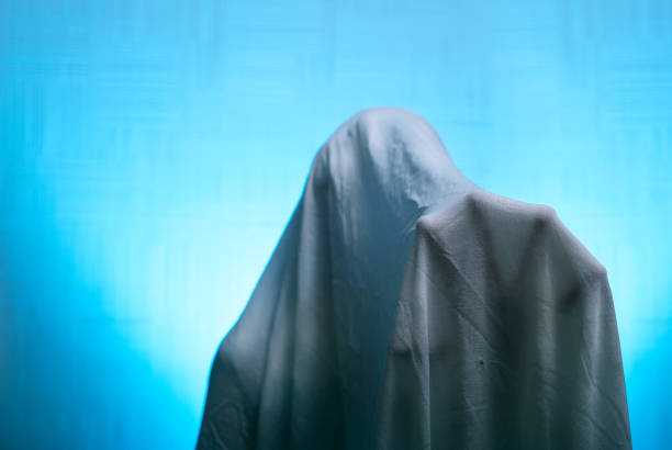 istock Spooky Ghost in the sheet held out his hand. 838520748