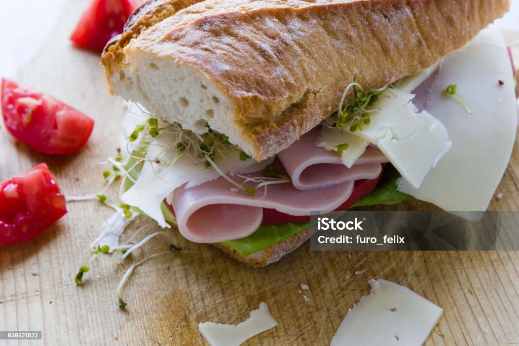 big ham sandwich rustic big ham sandwich on wooden board Baguette Stock Photo