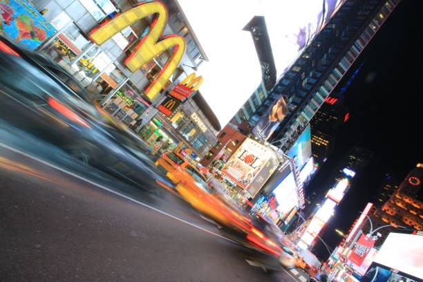 time square New York, USA - October 4 2016: the taxi move fast in time square at night in New York . time square is the most popular landmark and nightlife area in new york new york marathon photos stock pictures, royalty-free photos & images