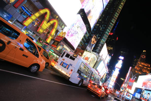 time square New York, USA - October 4 2016: the taxi move fast in time square at night in New York . time square is the most popular landmark and nightlife area in new york new york marathon photos stock pictures, royalty-free photos & images