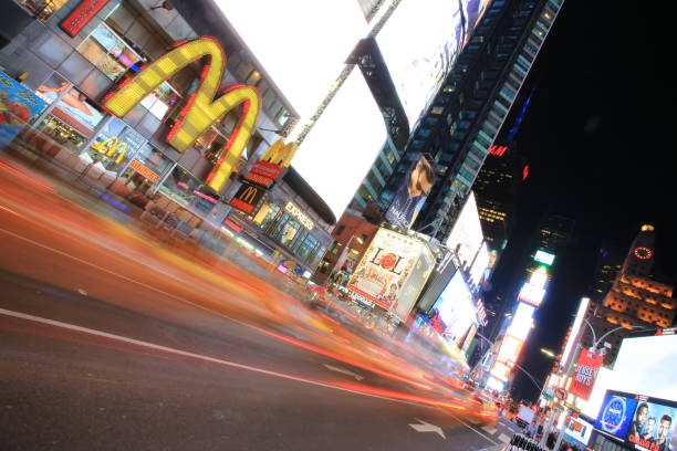 time square New York, USA - October 4 2016: the taxi move fast in time square at night in New York . time square is the most popular landmark and nightlife area in new york new york marathon photos stock pictures, royalty-free photos & images