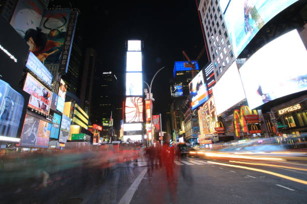 time square New York, USA - October 4 2016: the taxi move fast in time square at night in New York . time square is the most popular landmark and nightlife area in new york new york marathon photos stock pictures, royalty-free photos & images