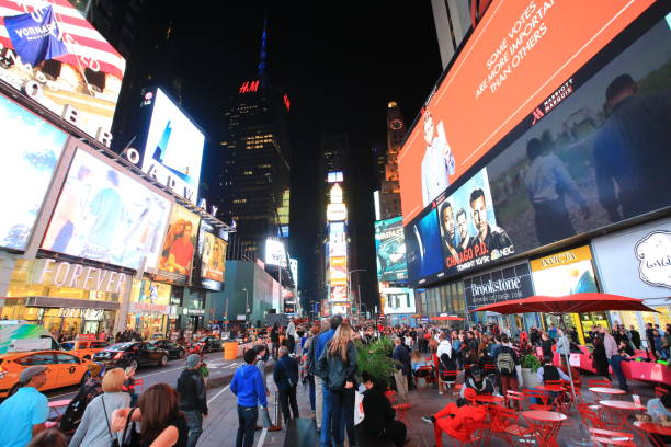 time square New York, USA - October 4 2016: the crowd in time square at night in New York . time square is the most popular landmark and nightlife area in new york new york marathon photos stock pictures, royalty-free photos & images
