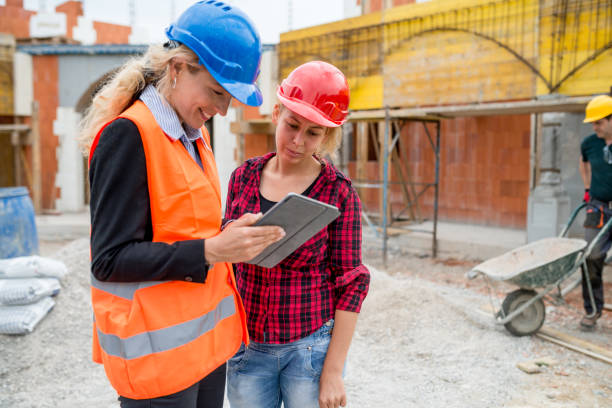 istock The supervisor and her assistant check the details on the digital tablet 838524242