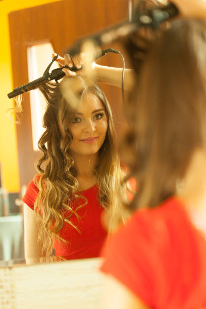 istock Attractive woman making hairstyle. 838524920