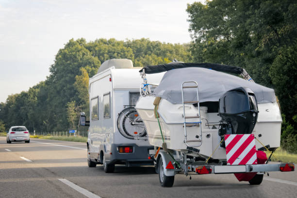 istock Caravan with trailer for motor boats road in Switzerland 838525708