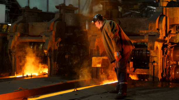 istock Heavy Industry Worker Working Hard in Foundry. Rough Industrial Environment. Wide Shot. 838527730