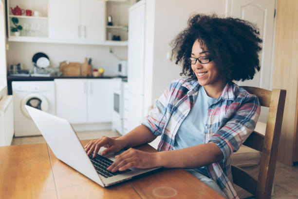 istock Woman with eyeglasses using laptop at home 838540638