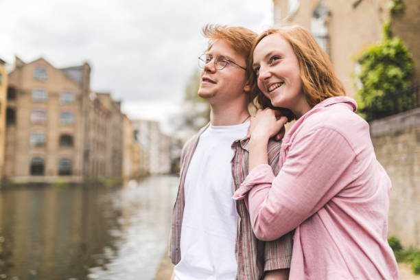 istock Red hair couple portrait on canalside 838541686