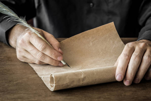 istock Hand writing with old quill pen on the old paper. Historical atmosphere. Empty place for a text. 838543840