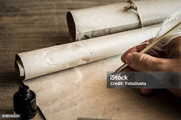 Hand Writing With Old Quill Pen On The Old Paper Historical Atmosphere Empty Place For A Text Stock Photo - Download Image Now