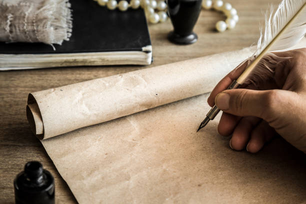 istock Hand writing with old quill pen on the old paper. Historical atmosphere. Empty place for a text. 838545698