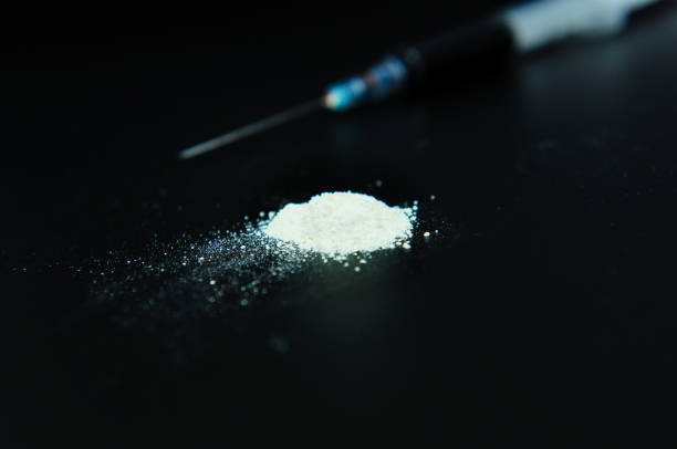 istock drug syringe and cooked heroin 838551352
